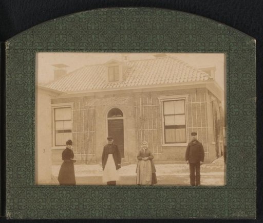 Four People in Front of a House