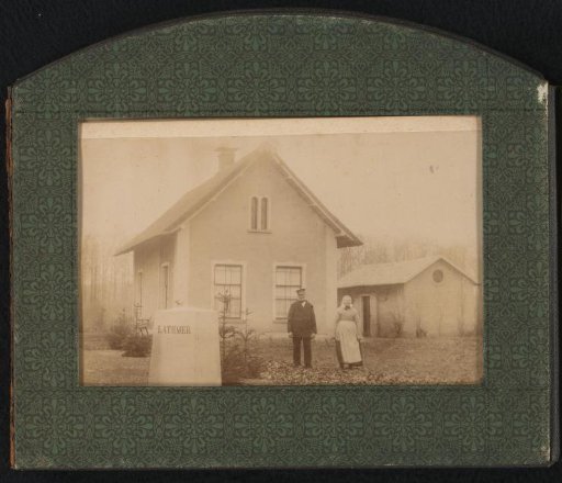 Man and Woman in Front of a House