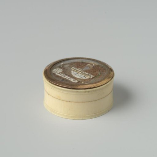 Box with a representation made of hair