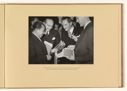 Mr Moh. Roem and Dr J.H. van Royen examine the photographs taken during the radio broadcast, in which they discussed the "final agreement"