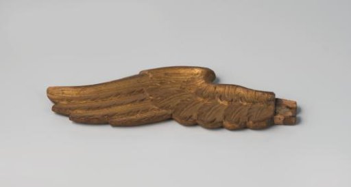 A broken wing belonging to a shield