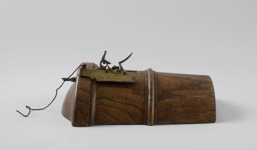Flint gunlock for a 12-pounder cannon on a wooden breech