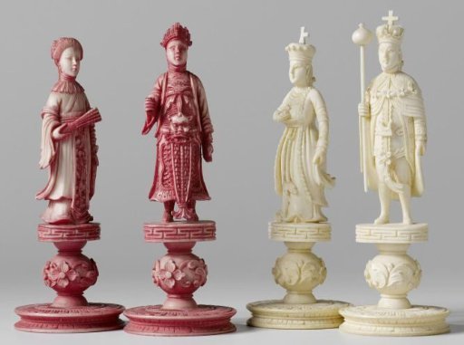 Chess pieces: 32 red and white ivory pieces without board.