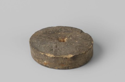 Round stone disc with a hole in the center