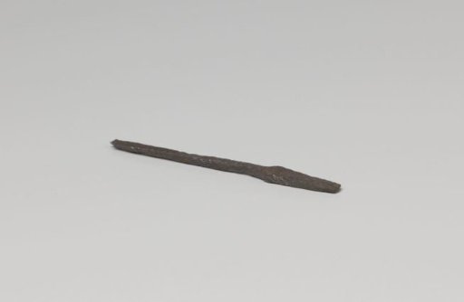 Fragment of a drill bit, flat at one end and grooved at the other