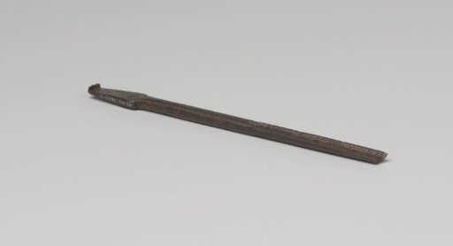 Fragment of a tool with a groove (like a chisel) at one end and rectangular flat at the other