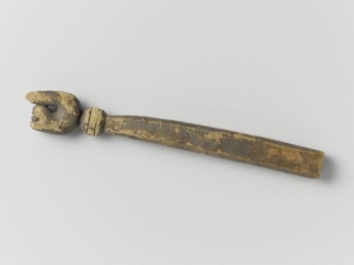 Fragment of wood, elongated with a round ring and knob