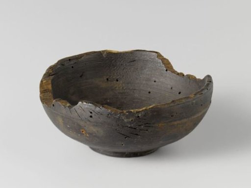 Small round drinking bowl with a low foot and sloping wall without handles