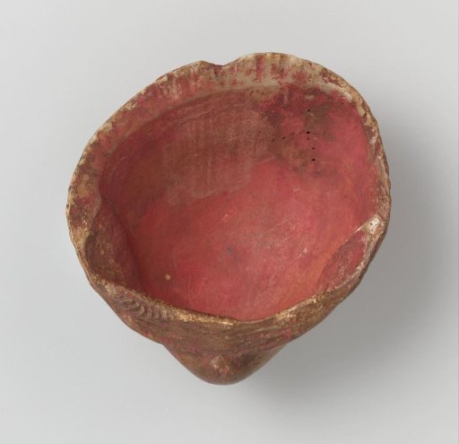 Shell with traces of red paint