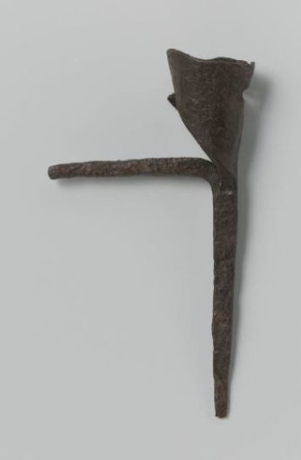 Candlestick consisting of a sleeve for a candle and two pins standing at right angles to each other