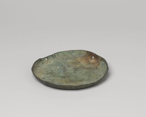 Dish, round in shape with drilled holes in the rim