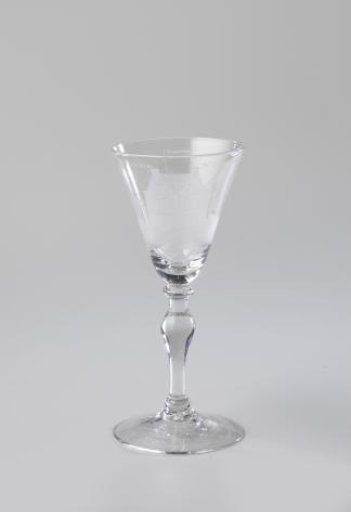 Goblet with a three-master at a quay and the inscription: DE GOEDE NEGOTIE