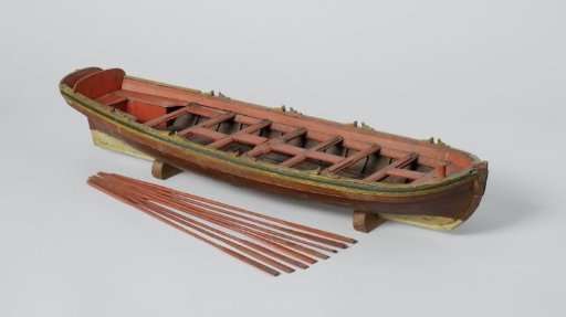 Model of a sailing ship with eight oars