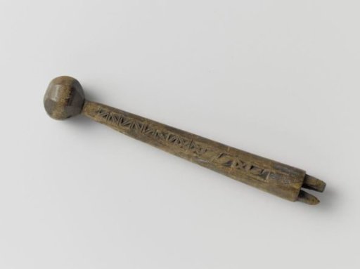 Handle with knob and a frieze with incised patterns