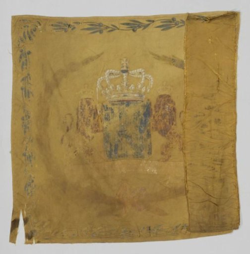 Fragment of a yellow-cream colored flag cloth trimmed with gold fringe. On the front a crowned ornate W, beneath which the inscription: AFDEELING KURASSIERS NO 1