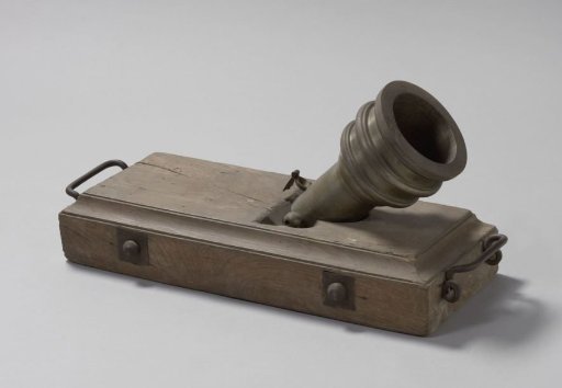 Iron mortar on a wooden stand