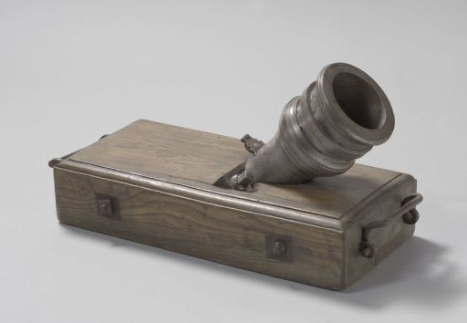 Iron mortar on a wooden stand