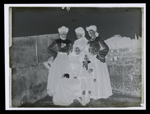 Group portrait of four unknown women and a girl