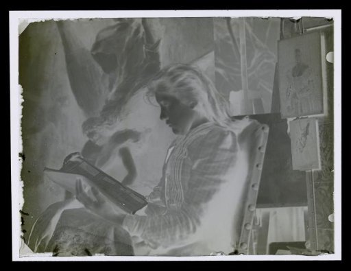 Portrait of an unknown reading woman in an atelier