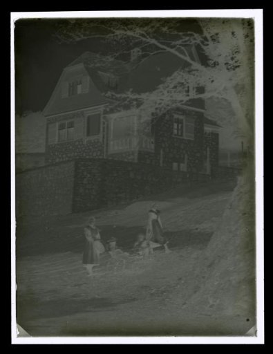 Two Girls with Two Children in Front of a House, Possibly in Erbach