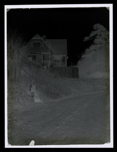 Woman Sitting in Front of a House, Probably in Erbach