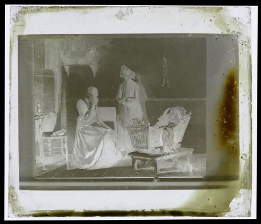 Photographic reproduction of a painting of a weeping woman by a bed