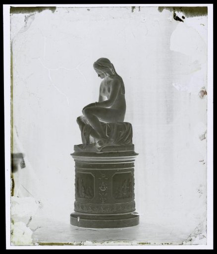Sculpture of a seated female nude