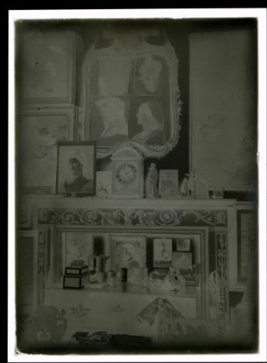 Mantelpiece with Artworks and Household Objects
