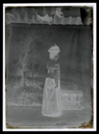 Standing Woman Before a Painted Interior
