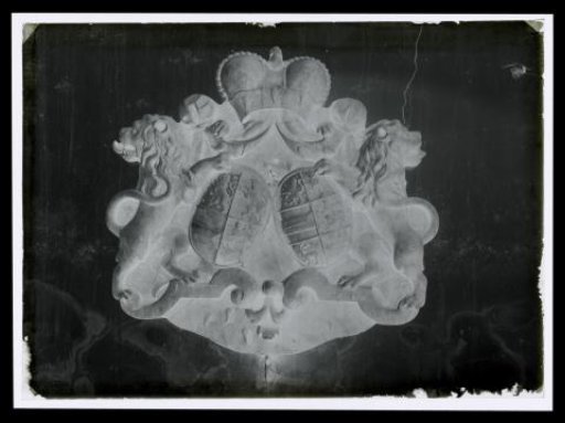 Photographic reproduction of a royal coat of arms in stone