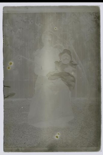 Portrait of an unknown woman with a child on her lap