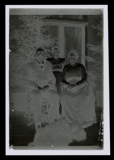 Group Portrait of an Unknown Man, Woman, and Girl, with a Dog Lying on the Ground Before Them