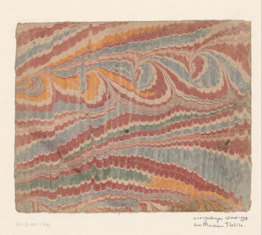Spiral comb marble in red, yellow, blue and green