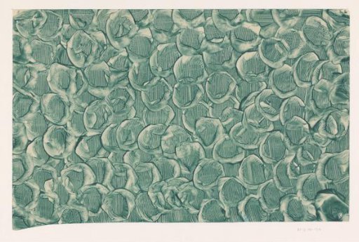 Brushed starched paper in green with scratched lines and embossed wheel motif