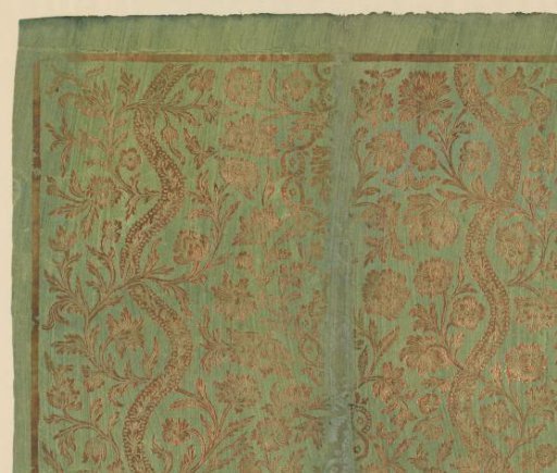 Sheet with two winding bands between scrolls with flowers