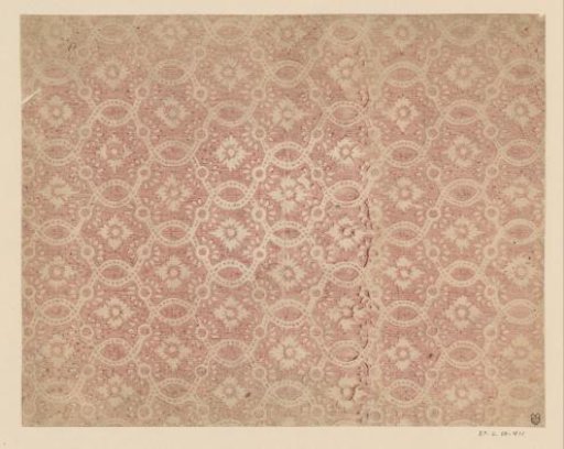 Sheet with a scattered pattern of flower between winding borders