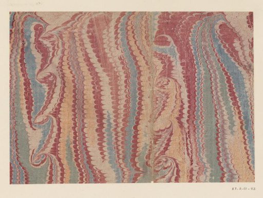 Spiral comb marble in red, yellow, blue and green