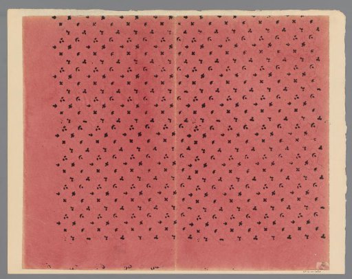 Sheet with scatter pattern of four motifs surrounded by line of dots