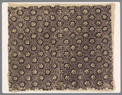 Sheet with a scattered pattern of cut-out leaf motifs between whimsical star-like forms