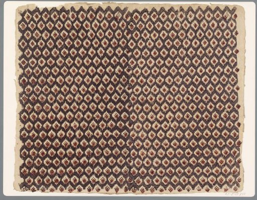 Sheet with scattered pattern of blocks over nine small squares in cut-out diamond motif