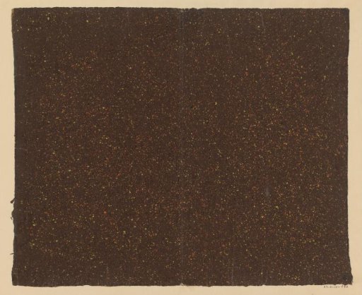Yellow and red speckled brown paper