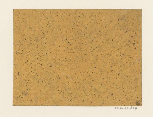 Black speckled yellow-brown paper