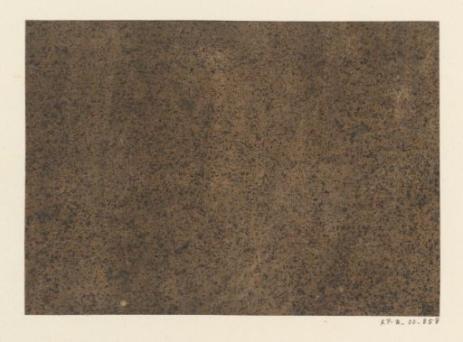 Black speckled brown paper