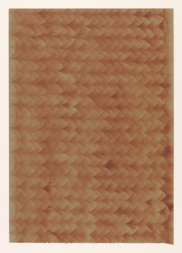 Stencilled paper with a pattern of bands of overlapping circles in red on brown paper