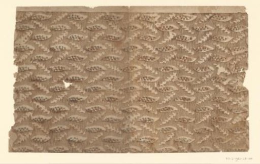 Sheet with an alternating scattered pattern of cut-out twigs and leaves
