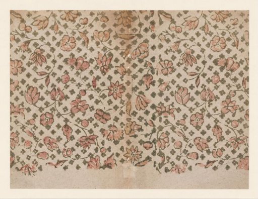 Sheet with a scattered pattern of flowers over a scattered pattern of leaves