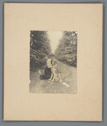 Jeannette de Lange with a Saint Bernard dog in the forest
