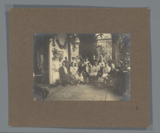 Family portrait of Kessler-De Lange in a conservatory