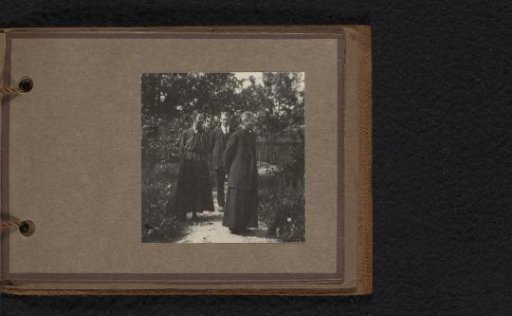Three Persons in a Garden