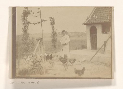 Man, presumably Stijn Streuvels, feeding chickens